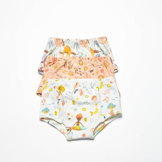 Three children's organic potty training underwear with mermaids prints on a white background size 4