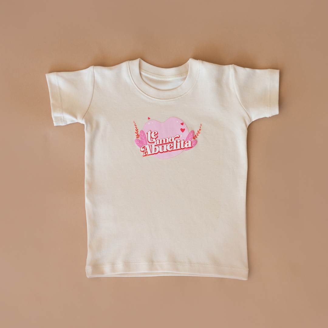 TE AMO ABUELITA ORGANIC GRAPHIC TEE. Crafted from the finest GOTS-certified organic natural colored Pima cotton from Peru, this tee is as gentle on your child's skin as it is on the environment. The soft, breathable fabric