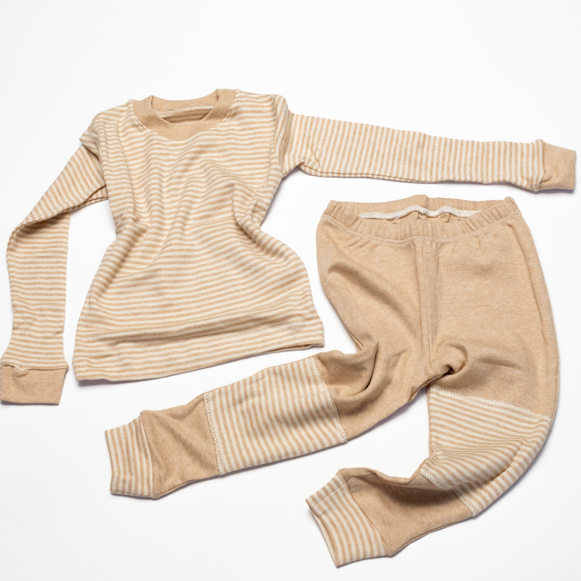 Organic Beige striped long-sleeve shirt and leg crawling pants on a white background