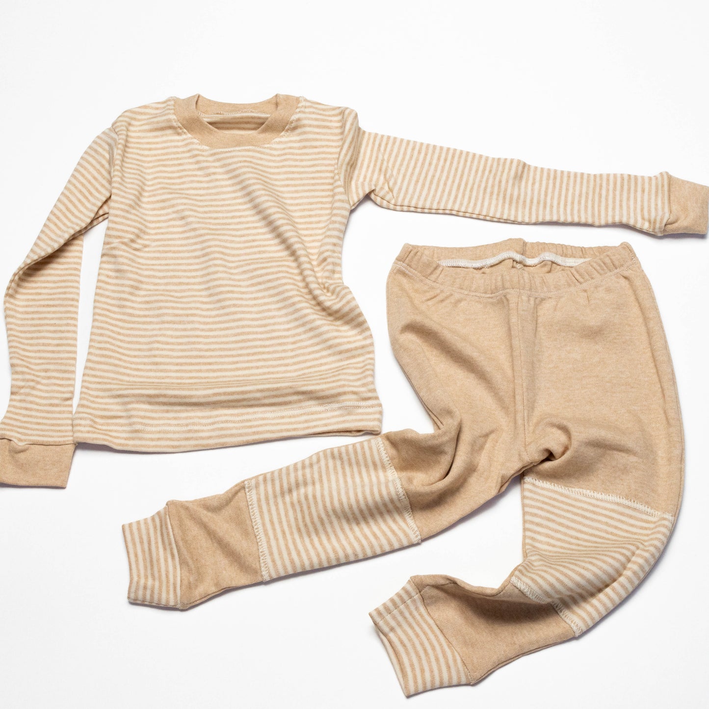 Organic Beige striped long-sleeve shirt and leg crawling pants on a white background