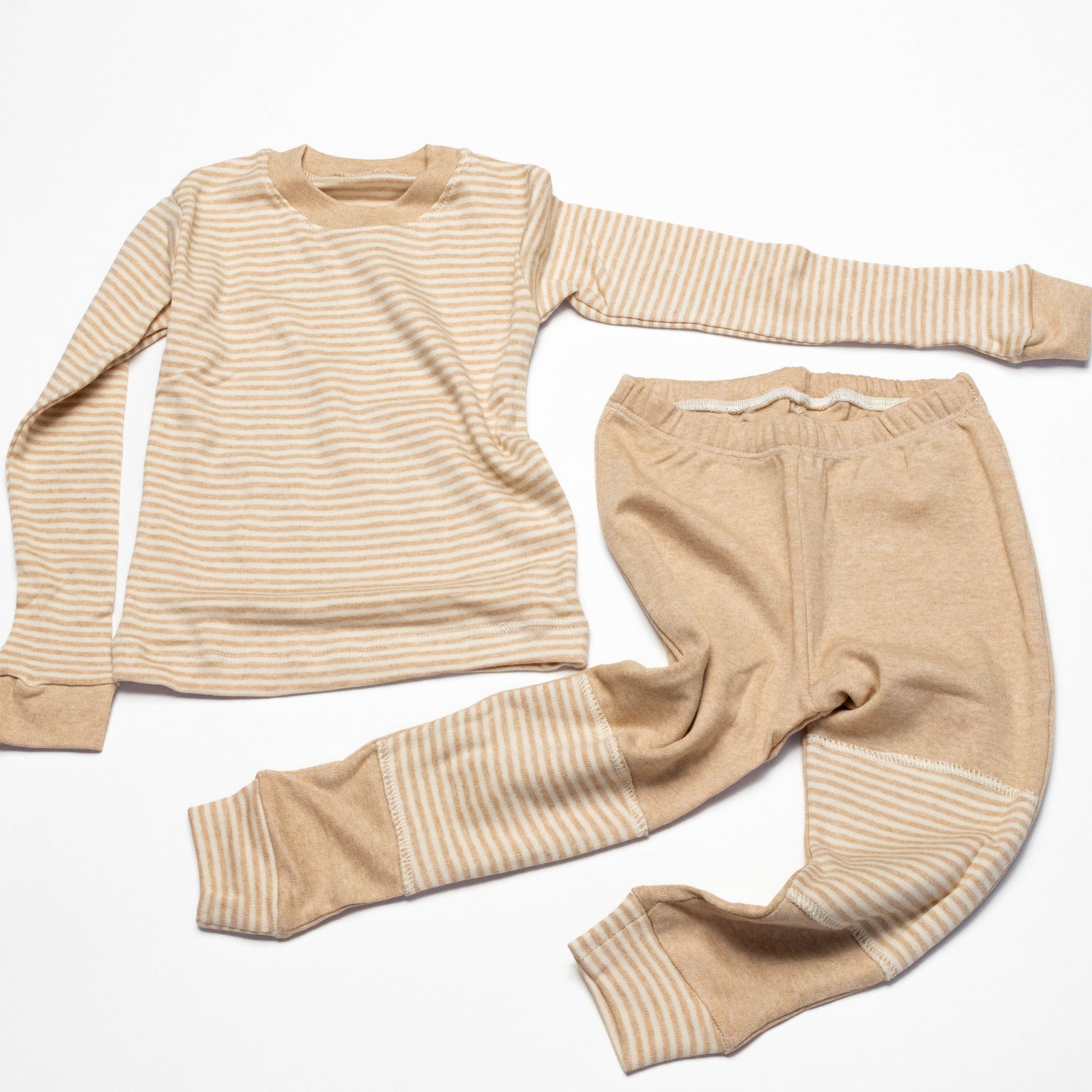 Organic Beige striped long-sleeve shirt and leg crawling pants on a white background