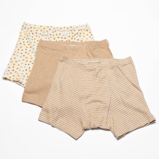 Three pairs of organic cotton boxer briefs in different patterns on a white background