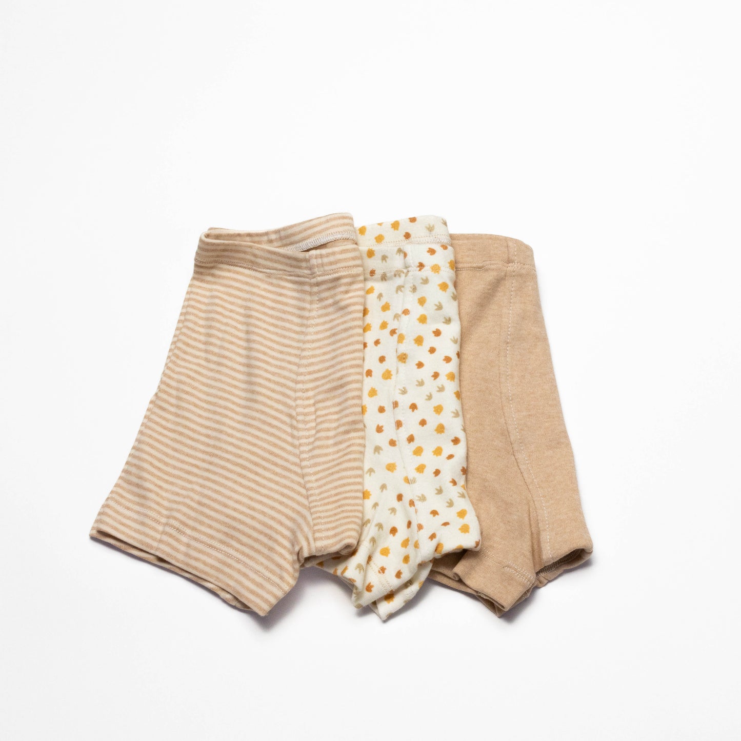 Three pairs of organic cotton boxer briefs in different patterns on a white background for sensitive skin size 8