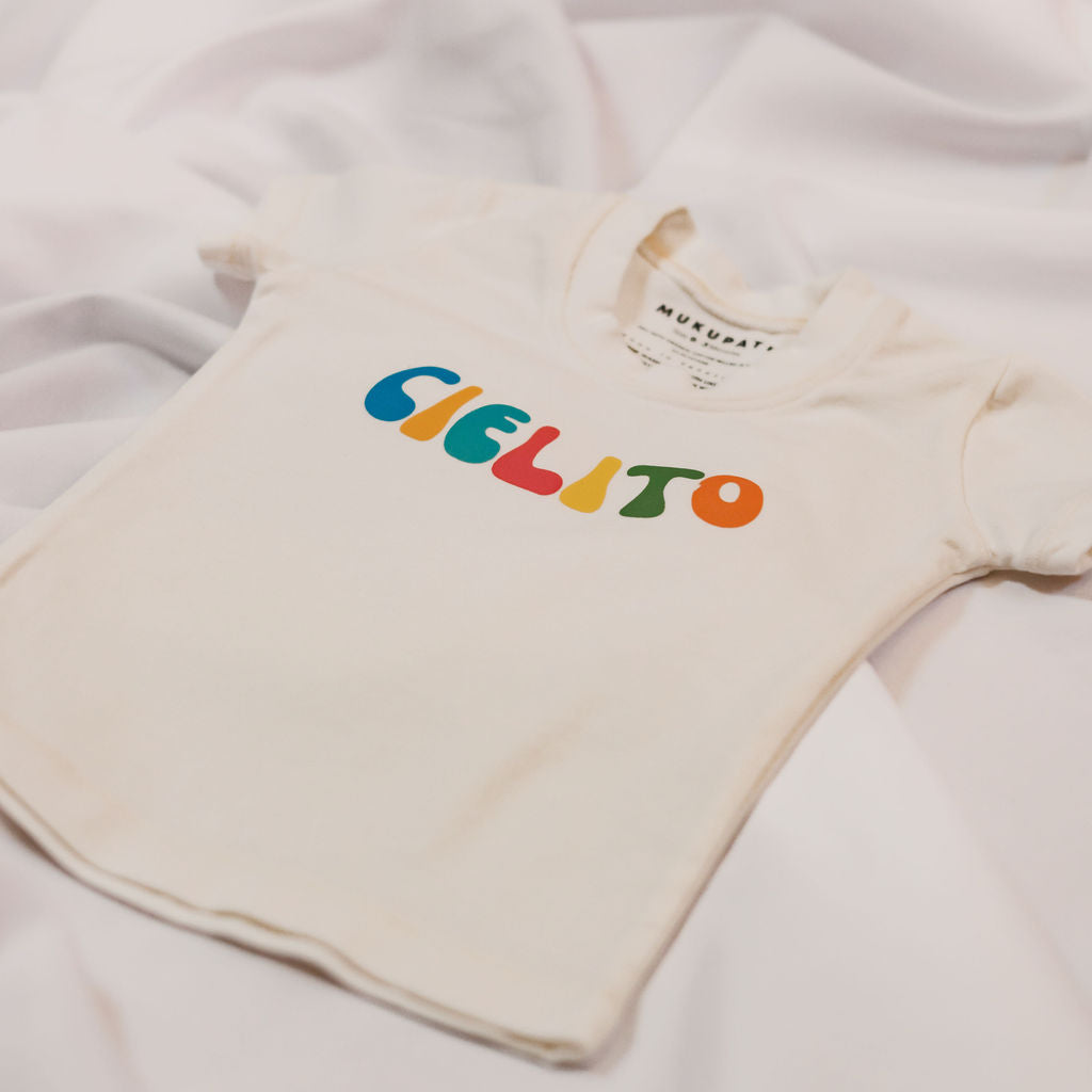 Baby top with the the word "Cielito" in colors