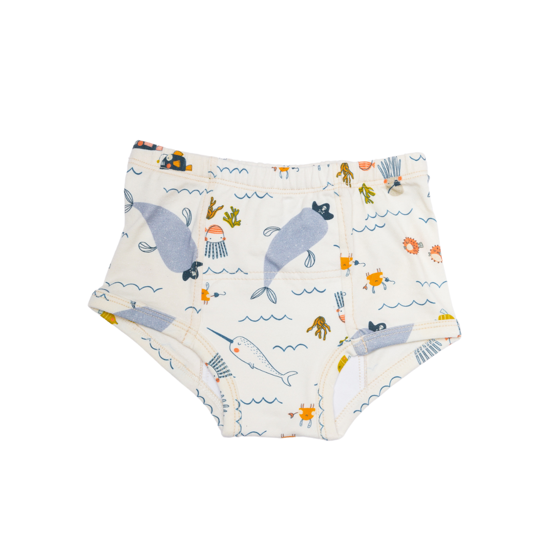 our underpants also feature a delightful ocean motif, showcasing graceful narwhals gliding through the sea. Known as the "unicorns of the sea," narwhals are enchanting creatures distinguished by their long, spiral tusks that extend from their heads. Our organic training pants comfortable construction using organic cotton, non toxic sustainable materials, our potty-training underpants seamlessly blend style with functionality. All our potty training underwear are Tag-less back for sensitive kids.